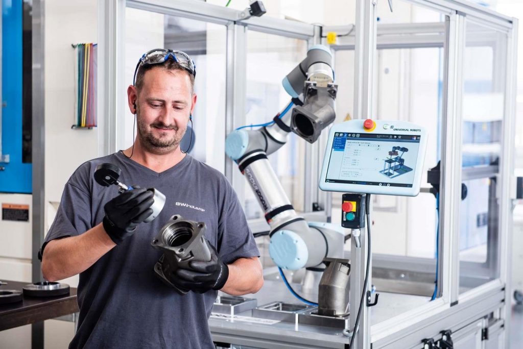 Man Using Robots for Welding